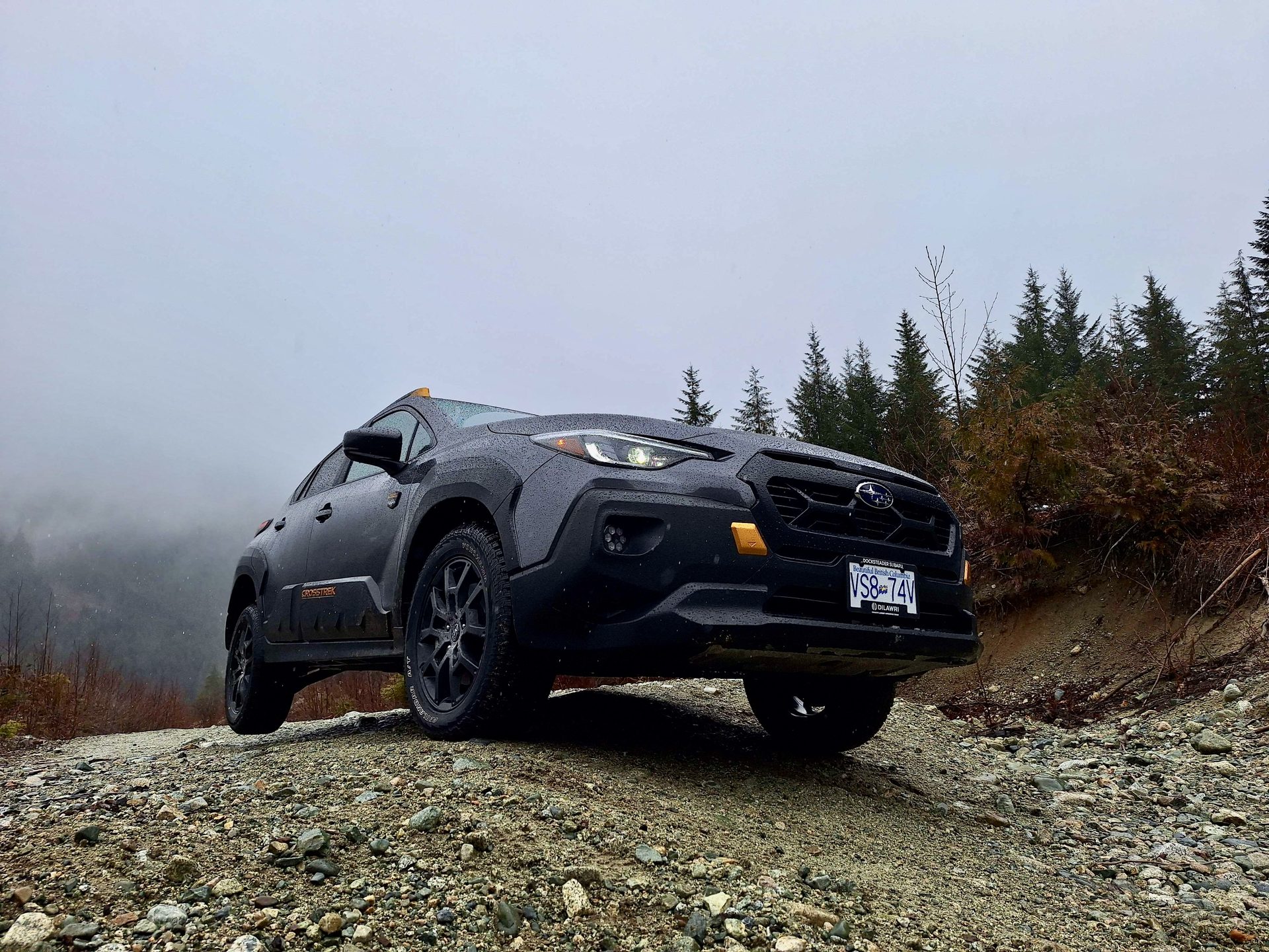Crosstrek on a foggy rocky hillside